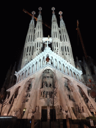 Southwest side of the Sagrada Família church with the Passion Facade, under construction, viewed from the Plaça de la Sagrada Família square, by night