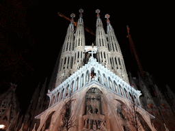 Southwest side of the Sagrada Família church with the Passion Facade, under construction, viewed from the Plaça de la Sagrada Família square, by night