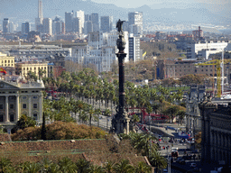 The Columbus Monument at the Plaça del Portal de la Pau square, viewed from the Plaça de l`Armada park at the northeast side of the Montjuïc hill