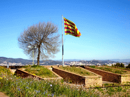 Catalan flag at the Santa Amàlia Bastion of the Montjuïc Castle at the southeast side of the Montjuïc hill, viewed from the front of the castle