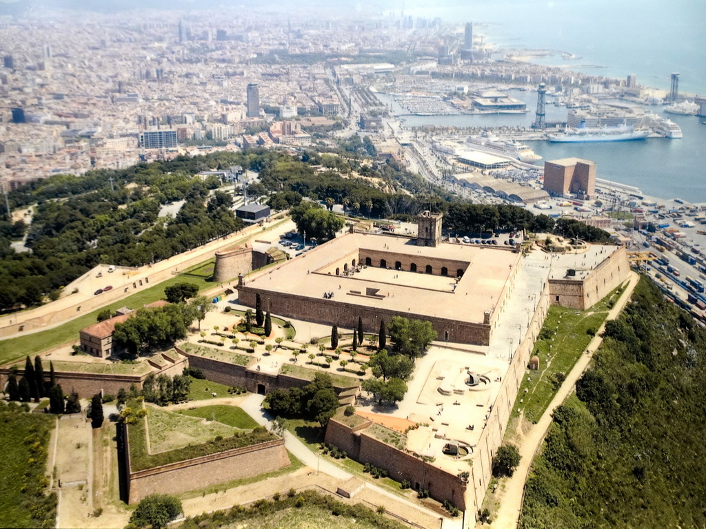 Photograph of Montjuïc Castle, the Port Vell harbour and the city center, at the Visitor Centre of the Montjuïc Castle at the southeast side of the Montjuïc hill