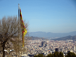 Catalan flag at the Santa Amàlia Bastion of the Montjuïc Castle at the southeast side of the Montjuïc hill and the city center with the Sagrada Família church, viewed from the Terrace