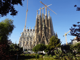 Northeast side of the Sagrada Família church with the Nativity Facade, under construction, viewed from the Plaça de Gaudí park