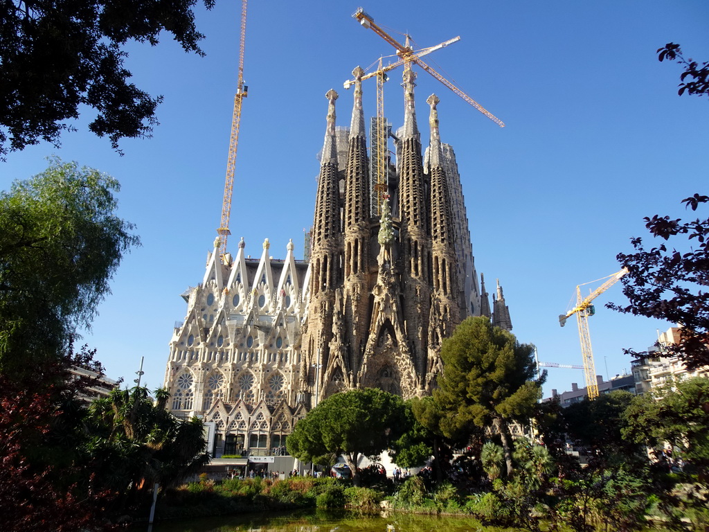 Northeast side of the Sagrada Família church with the Nativity Facade, under construction, viewed from the Plaça de Gaudí park