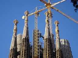 Northeast side of the towers of the Sagrada Família church, under construction, viewed from the Plaça de Gaudí park