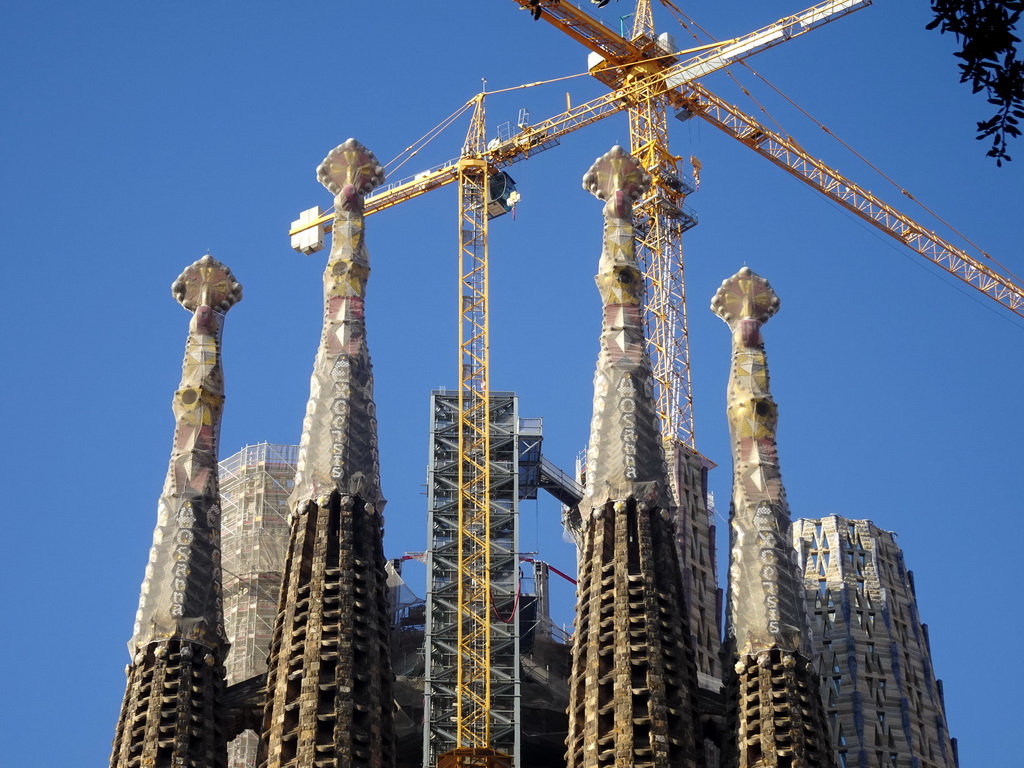 Northeast side of the towers of the Sagrada Família church, under construction, viewed from the Plaça de Gaudí park