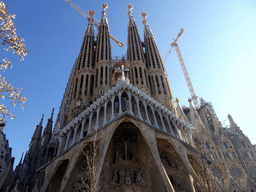 Southwest side of the Sagrada Família church with the Passion Facade, under construction, viewed from the Plaça de la Sagrada Família square