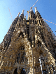 Northeast side of the Sagrada Família church with the Nativity Facade, under construction, viewed from the square right in front