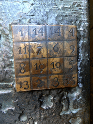 Magic square in the door at the right side of the Passion Facade at the southwest side of the Sagrada Família church