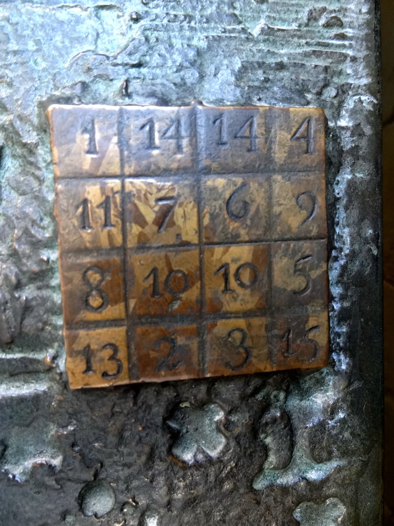 Magic square in the door at the right side of the Passion Facade at the southwest side of the Sagrada Família church