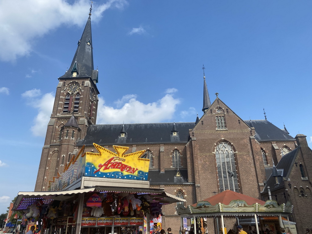 Funfair attractions and south side of the Heilige Maria Hemelvaartkerk church at the Brigidastraat street
