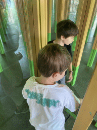 Max and his friend at the Rainforest Mirror Maze attraction at the funfair at the Brigidastraat street