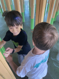 Max and his friend at the Rainforest Mirror Maze attraction at the funfair at the Brigidastraat street