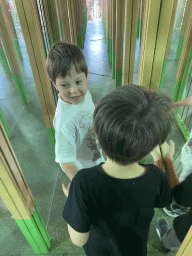 Max and his friend at the Rainforest Mirror Maze attraction at the funfair at the Brigidastraat street