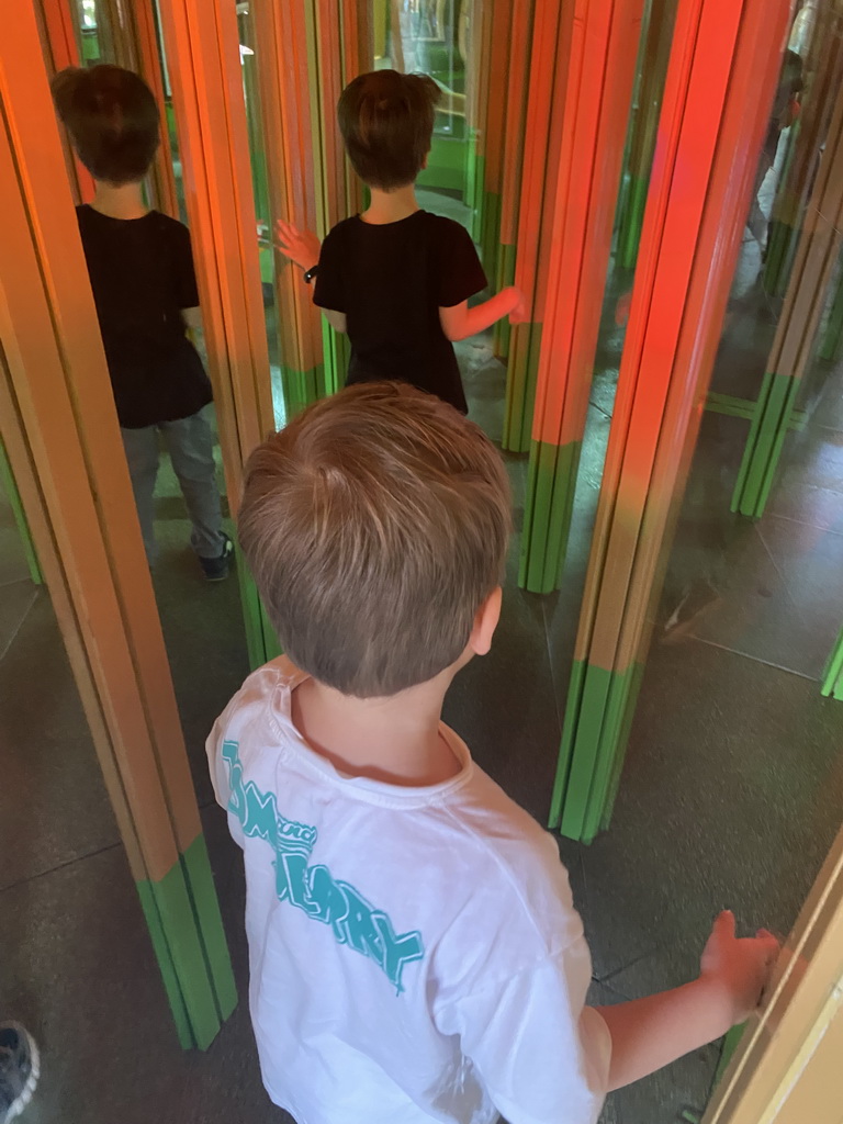 Max and his friend at the Rainforest Mirror Maze attraction at the funfair at the Brigidastraat street