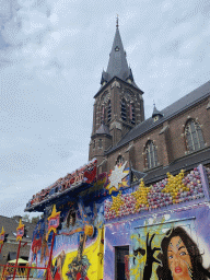 Funfair attraction and south side of the Heilige Maria Hemelvaartkerk church at the Brigidastraat street