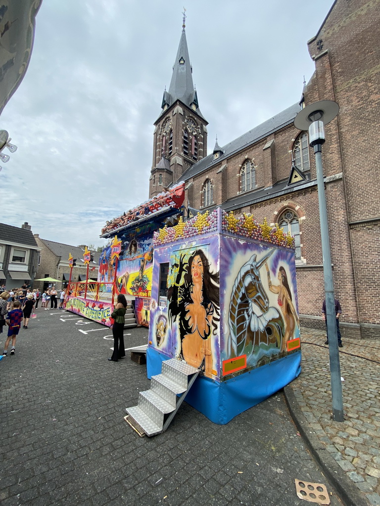 Funfair attraction and south side of the Heilige Maria Hemelvaartkerk church at the Brigidastraat street