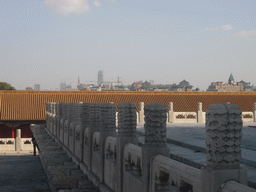 Skyscraper and other buildings in the city center, viewed from the front of the Hall of Complete Harmony at the Forbidden City