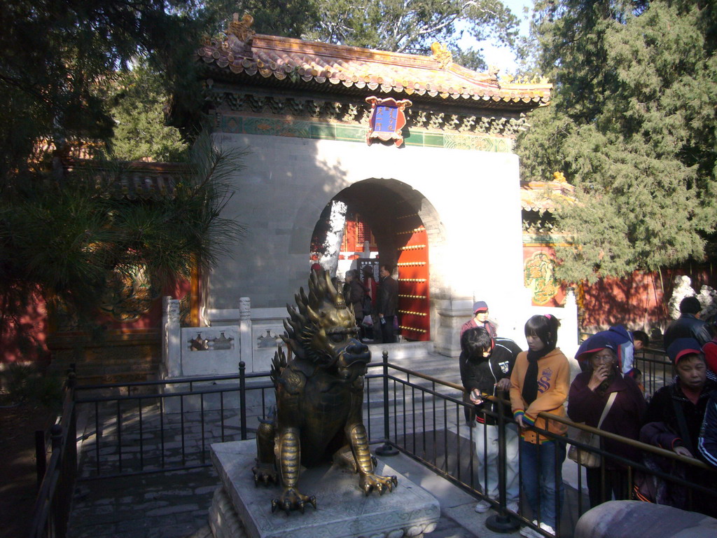 The One Heavenly Gate with a golden Chinese Unicorn statue at the Imperial Garden of the Forbidden City