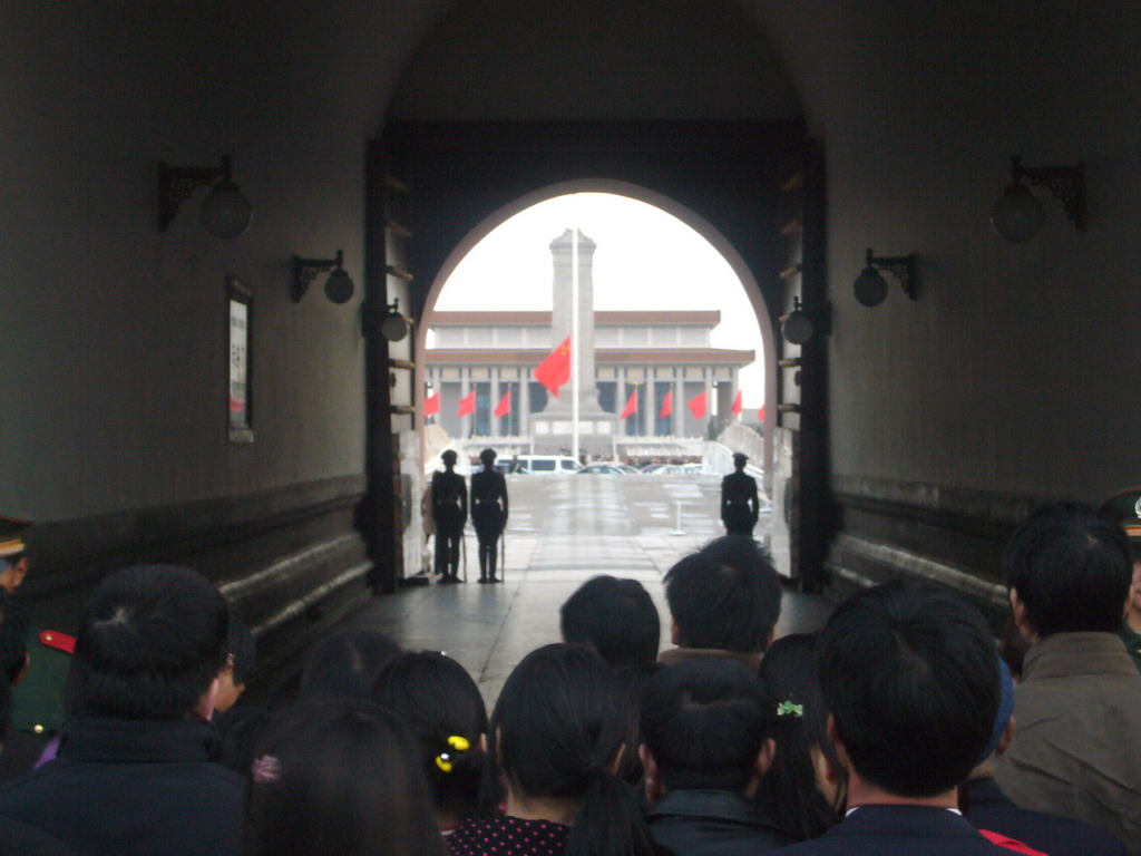 The Flag-Lowering Ceremony at Tiananmen Square, with the Monument to the People`s Heroes and the Mausoleum of Mao Zedong, viewed through the Gate of Heavenly Peace, at sunset