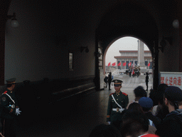 The Flag-Lowering Ceremony at Tiananmen Square, with the Monument to the People`s Heroes and the Mausoleum of Mao Zedong, viewed through the Gate of Heavenly Peace, at sunset