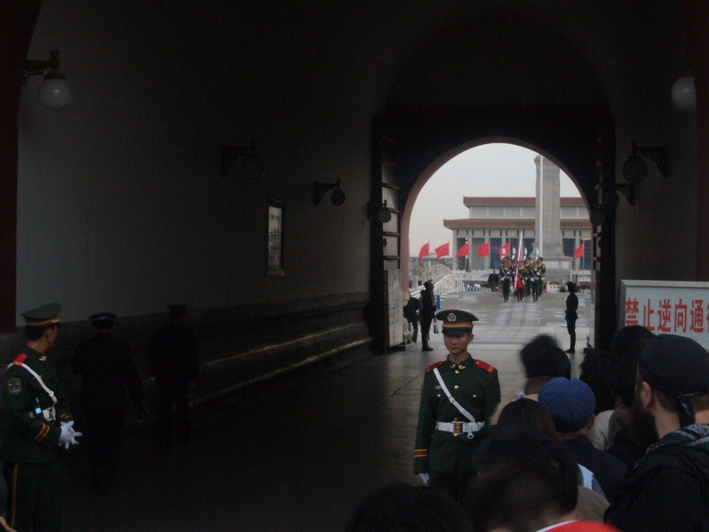 The Flag-Lowering Ceremony at Tiananmen Square, with the Monument to the People`s Heroes and the Mausoleum of Mao Zedong, viewed through the Gate of Heavenly Peace, at sunset