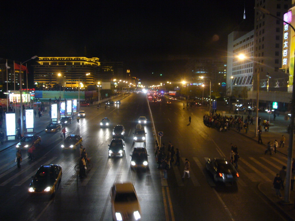 Xidan North Street, viewed from a walkway over the street, by night