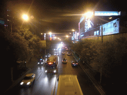 Xidan North Street, viewed from a walkway over the street, by night