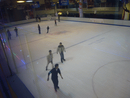 Ice rink in a shopping mall, by night