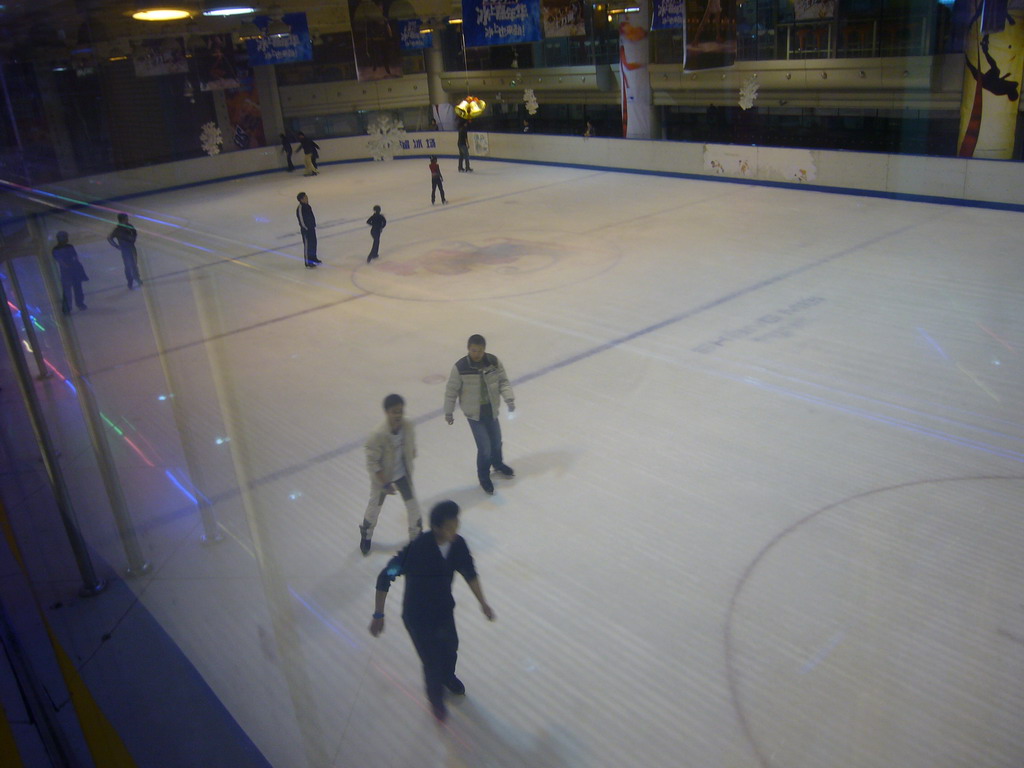 Ice rink in a shopping mall, by night