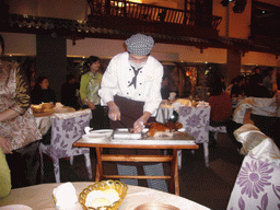 Cook preparing Peking Duck at the Quanjude Roast Duck Restaurant