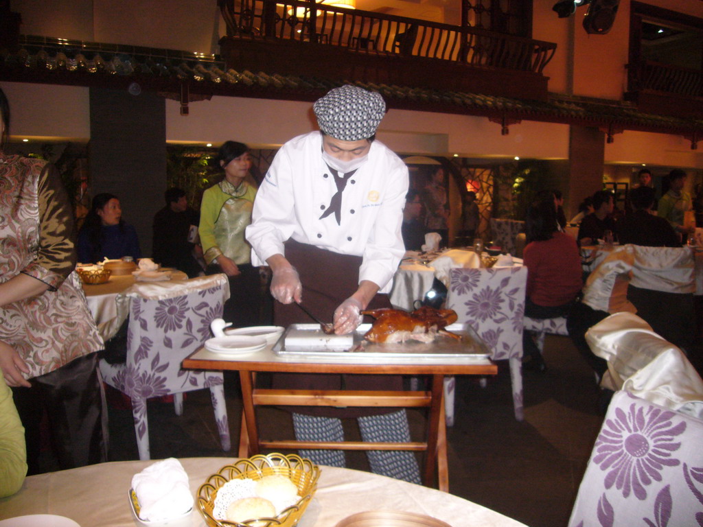 Cook preparing Peking Duck at the Quanjude Roast Duck Restaurant