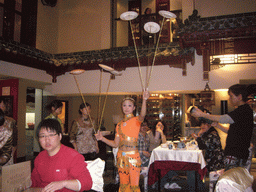 Acrobat with plates at the Quanjude Roast Duck Restaurant