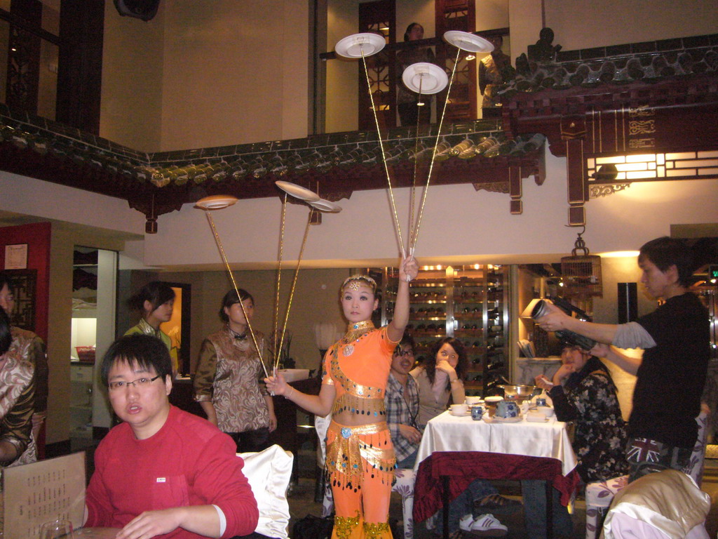 Acrobat with plates at the Quanjude Roast Duck Restaurant