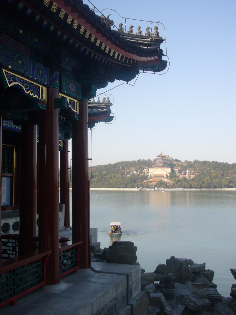 Corner of the Dragon King`s Temple at the South Lake Island at the Summer Palace, with a view on Kunming Lake and Longevity Hill with the Tower of Buddhist Incense