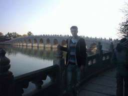 Tim at the South Lake Island at the Summer Palace, with a view on the Seventeen-Arch Bridge over Kunming Lake and the Pavilion of Broad View
