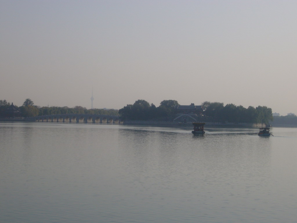 Boats on Kunming Lake, the Seventeen-Arch Bridge and South Lake Island with the Hall Of Embracing The Universe at the Summer Palace, viewed from the Gate of Dispelling Clouds