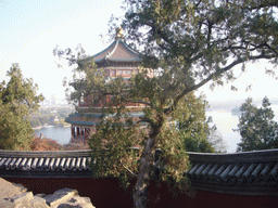 The back side of the Tower of Buddhist Incense, Kunming Lake, the Seventeen-Arch Bridge and South Lake Island at the Summer Palace, viewed from the Hall of the Sea of Wisdom
