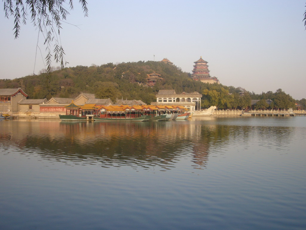 The Marble Boat and other boats at the northwest side of Kunming Lake and Longevity Hill with the Tower of Buddhist Incense and the Hall of the Sea of Wisdom at the Summer Palace, viewed from the West Causeway