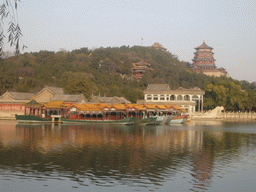 The Marble Boat and other boats at the northwest side of Kunming Lake and Longevity Hill with the Tower of Buddhist Incense and the Hall of the Sea of Wisdom at the Summer Palace, viewed from the West Causeway