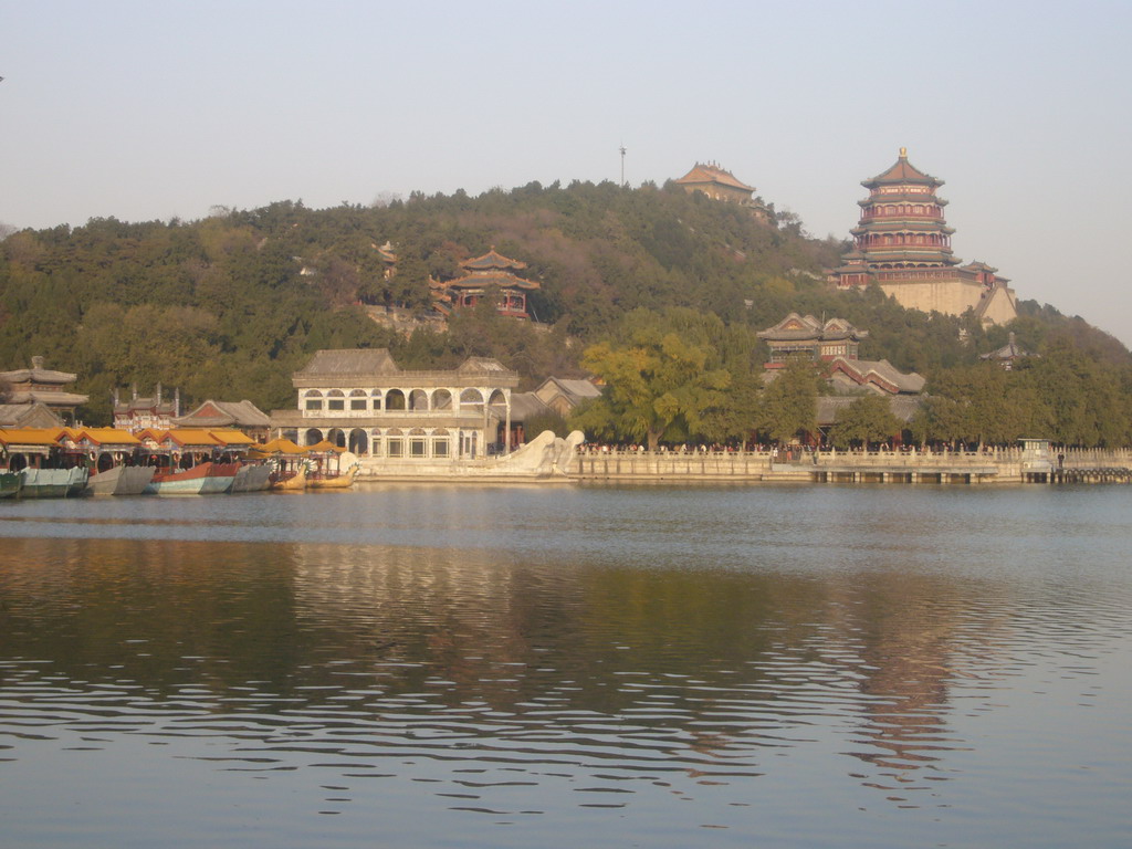 The Marble Boat and other boats at the northwest side of Kunming Lake and Longevity Hill with the Tower of Buddhist Incense and the Hall of the Sea of Wisdom at the Summer Palace, viewed from the West Causeway