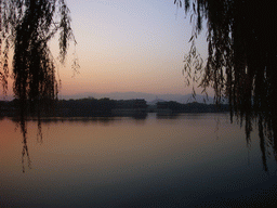 Kunming Lake and the Pavilion of Bright Scenery at the Summer Palace, and the Jade Spring Hill with the Yufeng Pagoda, at sunset