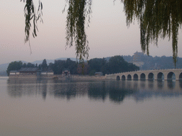 Kunming Lake, the Seventeen-Arch Bridge, South Lake Island and Longevity Hill with the Tower of Buddhist Incense at the Summer Palace, at sunset