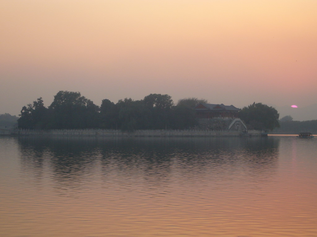 Kunming Lake and South Lake Island with the Hall Of Embracing The Universe at the Summer Palace, viewed from the East Causeway, at sunset