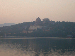 Kunming Lake and Longevity Hill with the Tower of Buddhist Incense and the Hall of the Sea of Wisdom at the Summer Palace, viewed from the East Causeway, at sunset