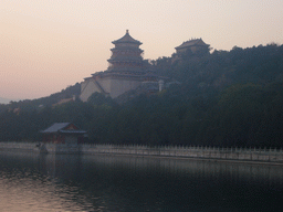 Kunming Lake and Longevity Hill with the Tower of Buddhist Incense and the Hall of the Sea of Wisdom at the Summer Palace, viewed from the East Causeway, at sunset