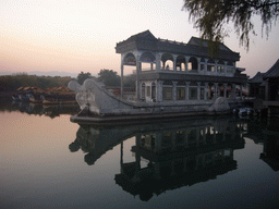 The Marble Boat and other boats at the northwest side of Kunming Lake at the Summer Palace, at sunset