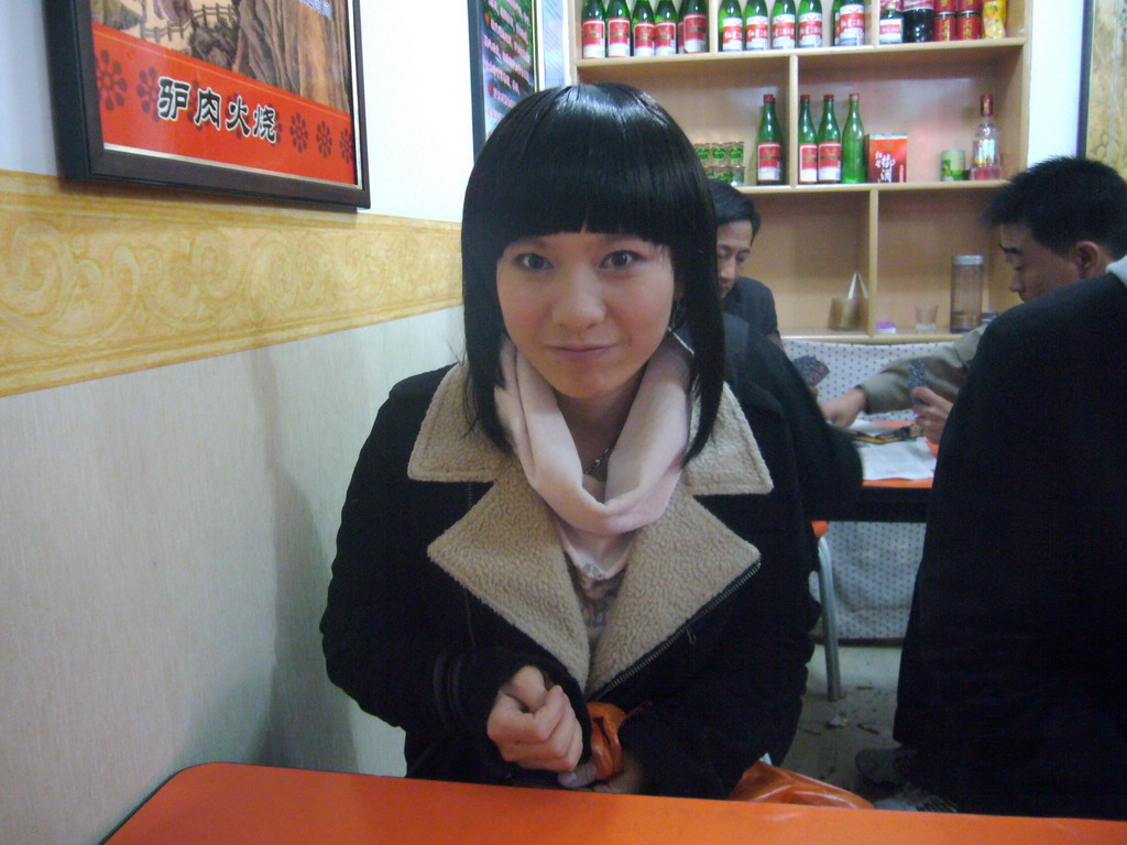 Miaomiao`s cousin in a restaurant at the city center