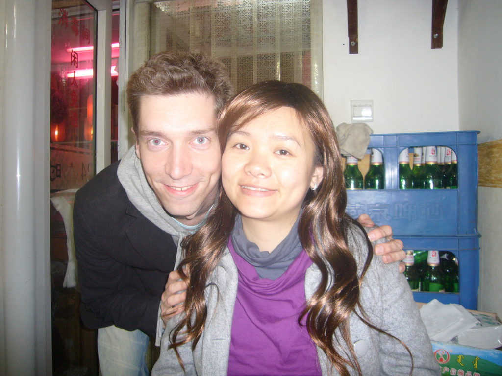 Tim and Miaomiao in a restaurant at the city center