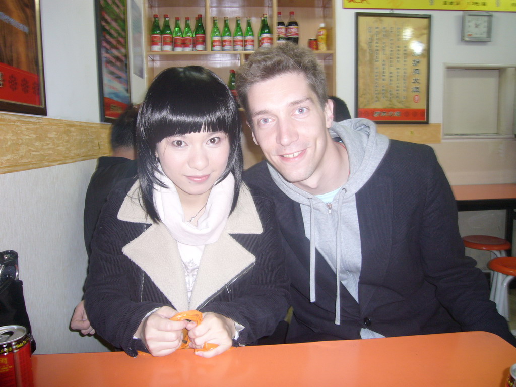 Tim and Miaomiao`s cousin in a restaurant at the city center